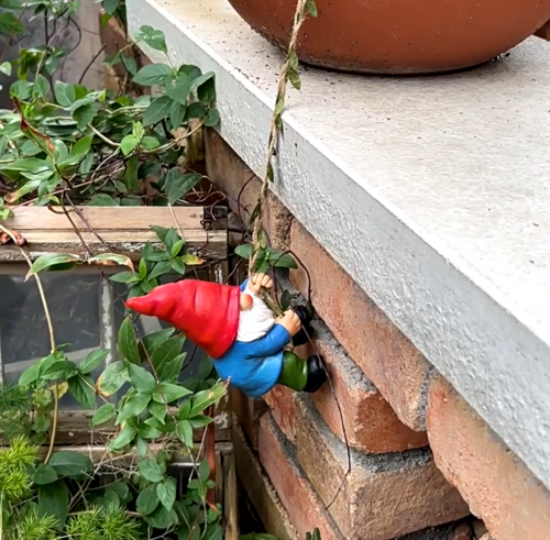 Click to view full screen Runaway Gnome Figurine Climbing on The Wall review-2